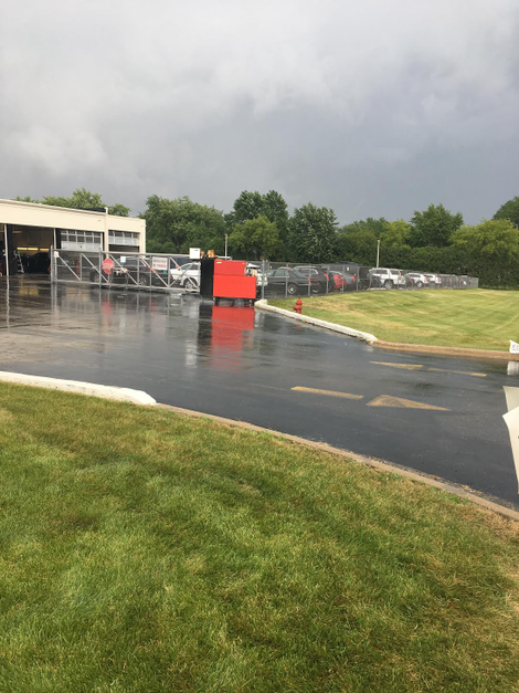 What Joe Schubkegel says to be his toolbox, sitting in the rain after the dealership allegedly pushed it outside and it got stuck in the asphalt. Photo credit: Joe Schubkegel